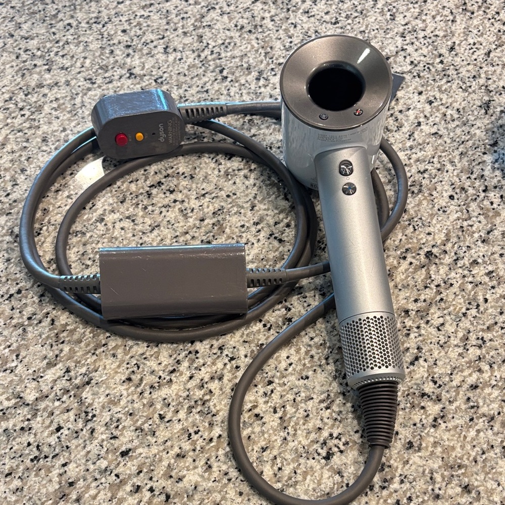 Dyson Supersonic Hairdryer with attachments. White/silver
